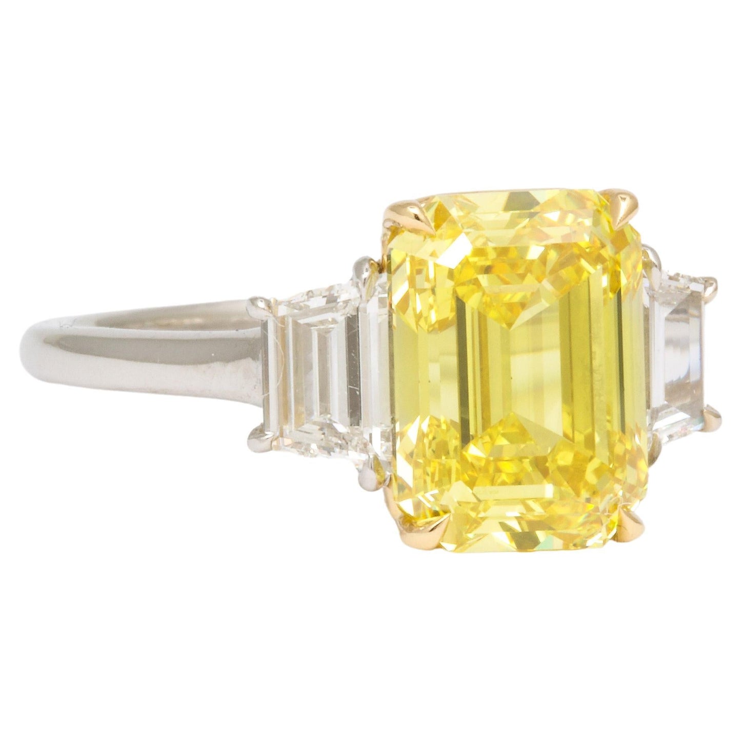 https://a.1stdibscdn.com/fancy-vivid-yellow-emerald-cut-ring-for-sale/j_415/j_174482921667400138155/j_17448292_1667400138733_bg_processed.jpg