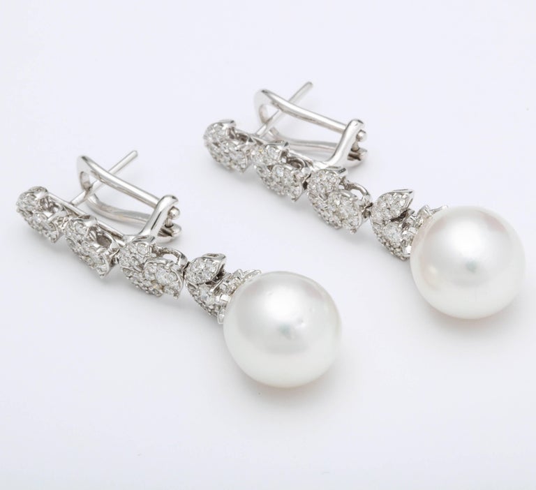 https://a.1stdibscdn.com/pearl-and-diamond-earrings-for-sale-picture-2/j_415/j_193187421684333966718/1_main-9_master.jpg?width=768