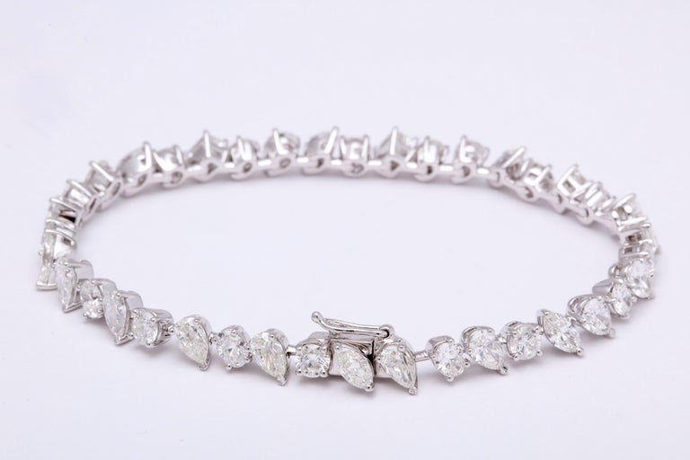 https://a.1stdibscdn.com/multi-shape-diamond-tennis-bracelet-for-sale-picture-2/366869/j_57882221553111184123/1_main_2_org_master.jpg?width=768