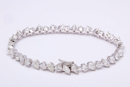 https://a.1stdibscdn.com/multi-shape-diamond-tennis-bracelet-for-sale-picture-2/366869/j_57882221553111184123/1_main_2_org_master.jpg?width=768