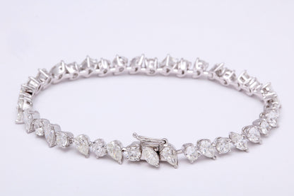 https://a.1stdibscdn.com/multi-shape-diamond-tennis-bracelet-for-sale-picture-2/366869/j_57882221553111184123/1_main_2_org_master.jpg