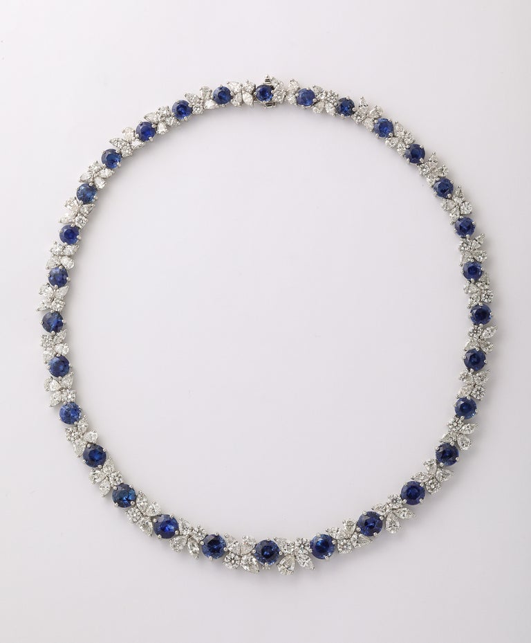 https://a.1stdibscdn.com/blue-sapphire-and-diamond-necklace-for-sale-picture-2/j_415/j_227289521714486587770/2P6A1547_master.jpg?width=768