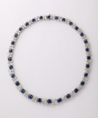https://a.1stdibscdn.com/blue-sapphire-and-diamond-necklace-for-sale-picture-2/j_415/j_227289521714486587770/2P6A1547_master.jpg?width=768