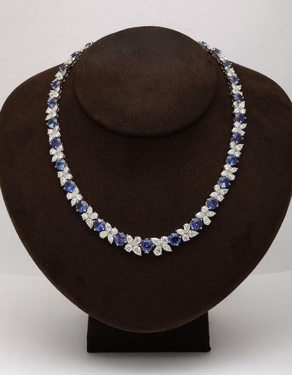 https://a.1stdibscdn.com/blue-sapphire-and-diamond-necklace-for-sale-picture-3/j_415/j_227289521714486587656/2P6A1548_master.jpg?width=768