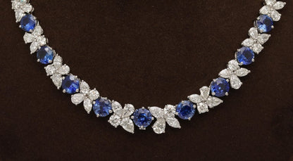 https://a.1stdibscdn.com/blue-sapphire-and-diamond-necklace-for-sale-picture-4/j_415/j_227289521714486587706/2P6A1549_master.jpg?width=768
