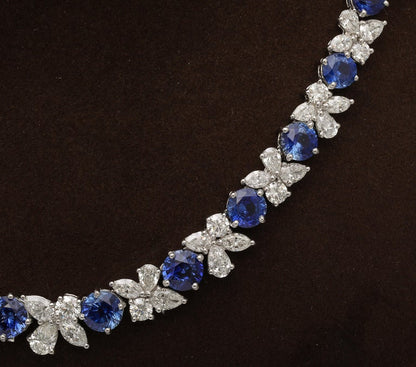 https://a.1stdibscdn.com/blue-sapphire-and-diamond-necklace-for-sale-picture-5/j_415/j_227289521714486587720/2P6A1550_master.jpg?width=768
