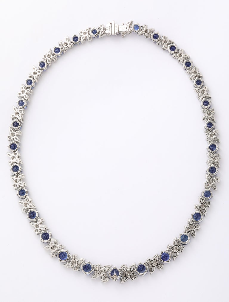 https://a.1stdibscdn.com/blue-sapphire-and-diamond-necklace-for-sale-picture-9/j_415/j_227289521714486592000/2P6A1554_master.jpg?width=768