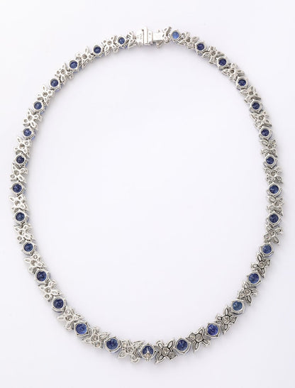 https://a.1stdibscdn.com/blue-sapphire-and-diamond-necklace-for-sale-picture-9/j_415/j_227289521714486592000/2P6A1554_master.jpg?width=768