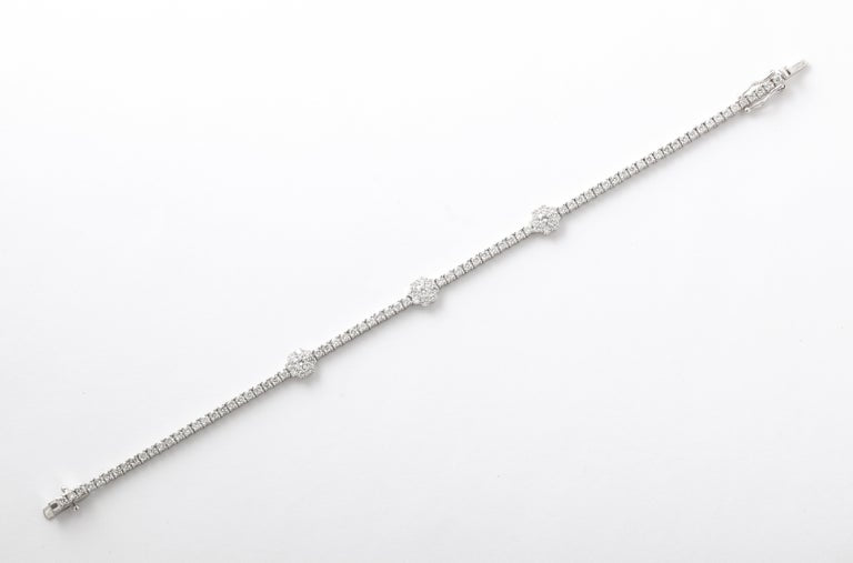 https://a.1stdibscdn.com/flower-diamond-tennis-bracelet-for-sale-picture-2/j_415/j_216140721705596565185/6R1A0161_master.jpg?width=768