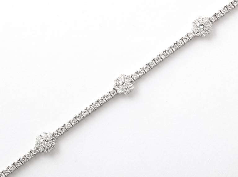 https://a.1stdibscdn.com/flower-diamond-tennis-bracelet-for-sale-picture-3/j_415/j_216140721705596565196/6R1A0162_master.jpg?width=768