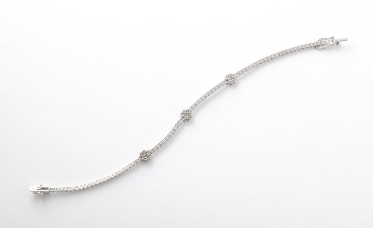 https://a.1stdibscdn.com/flower-diamond-tennis-bracelet-for-sale-picture-5/j_415/j_216140721705596565314/6R1A0164_master.jpg?width=768