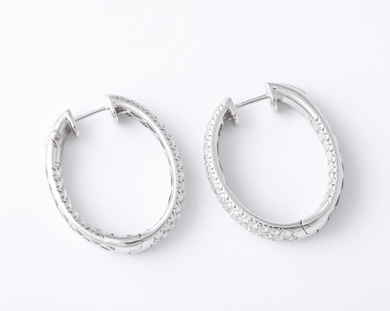 https://a.1stdibscdn.com/pave-diamond-oval-hoop-earrings-for-sale-picture-7/j_415/j_124611321622815549854/6R1A0532_master.jpg?width=768