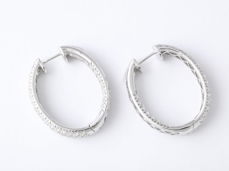 https://a.1stdibscdn.com/pave-diamond-oval-hoop-earrings-for-sale-picture-8/j_415/j_124611321622815553796/6R1A0533_master.jpg?width=768
