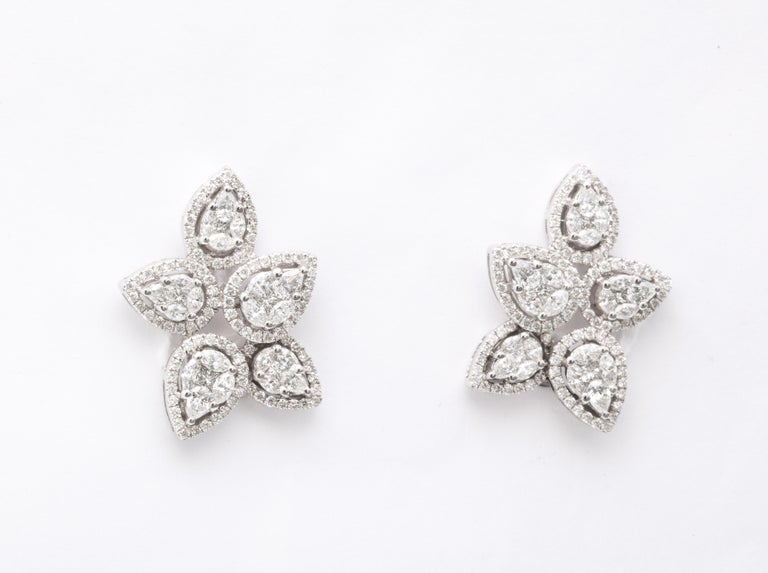 https://a.1stdibscdn.com/diamond-cluster-earrings-for-sale-picture-2/j_415/j_140275121637953079829/6R1A1259_master.jpg?width=768