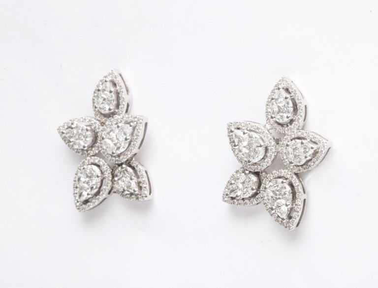 https://a.1stdibscdn.com/diamond-cluster-earrings-for-sale-picture-3/j_415/j_140275121637953079768/6R1A1265_master.jpg?width=768
