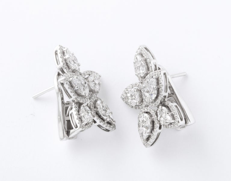https://a.1stdibscdn.com/diamond-cluster-earrings-for-sale-picture-4/j_415/j_140275121637953079641/6R1A1269_2__master.jpg?width=768