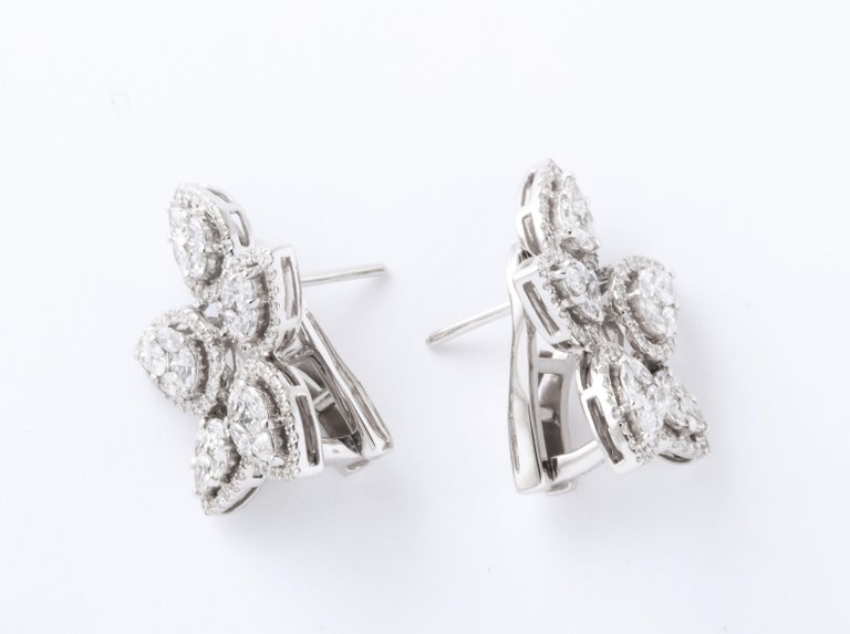 https://a.1stdibscdn.com/diamond-cluster-earrings-for-sale-picture-5/j_415/j_140275121637953079559/6R1A1270_master.jpg?width=768