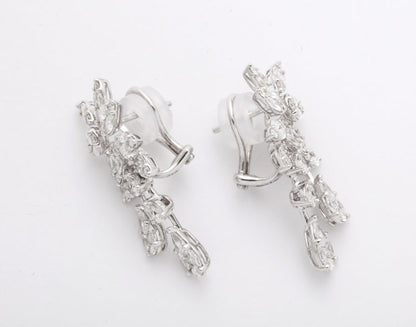 https://a.1stdibscdn.com/diamond-cluster-dangle-earring-for-sale-picture-8/j_415/j_160698521655143269604/6R1A1381_master.jpg?width=768