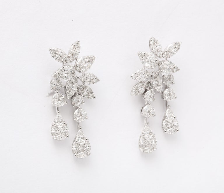 https://a.1stdibscdn.com/diamond-cluster-dangle-earring-for-sale-picture-6/j_415/j_160698521655143273787/6R1A1394_master.jpg?width=768