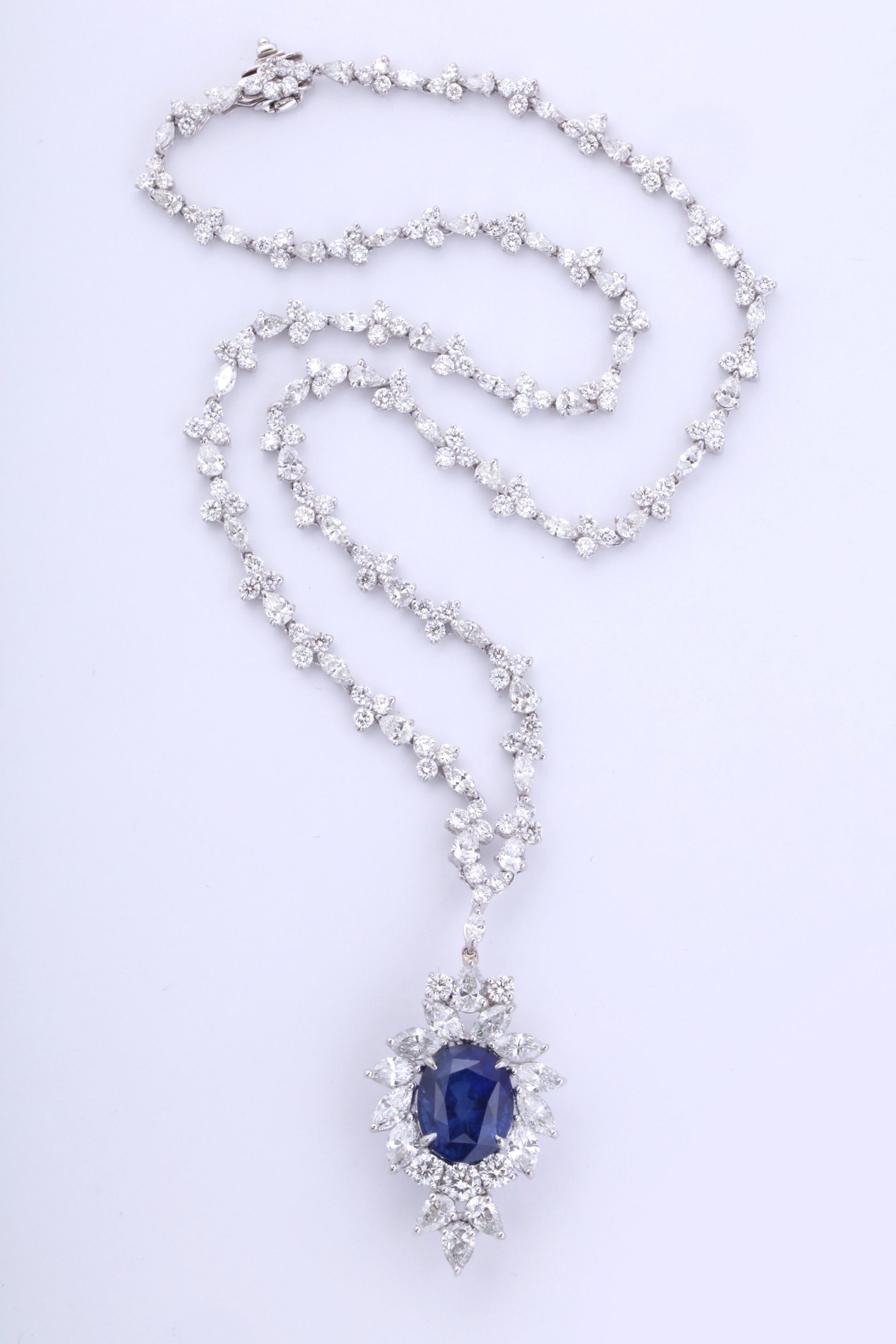https://a.1stdibscdn.com/vivid-blue-ceylon-sapphire-and-diamond-pendant-necklace-for-sale-picture-2/0/j_56032021544653088863/6R1A3346_master.jpg