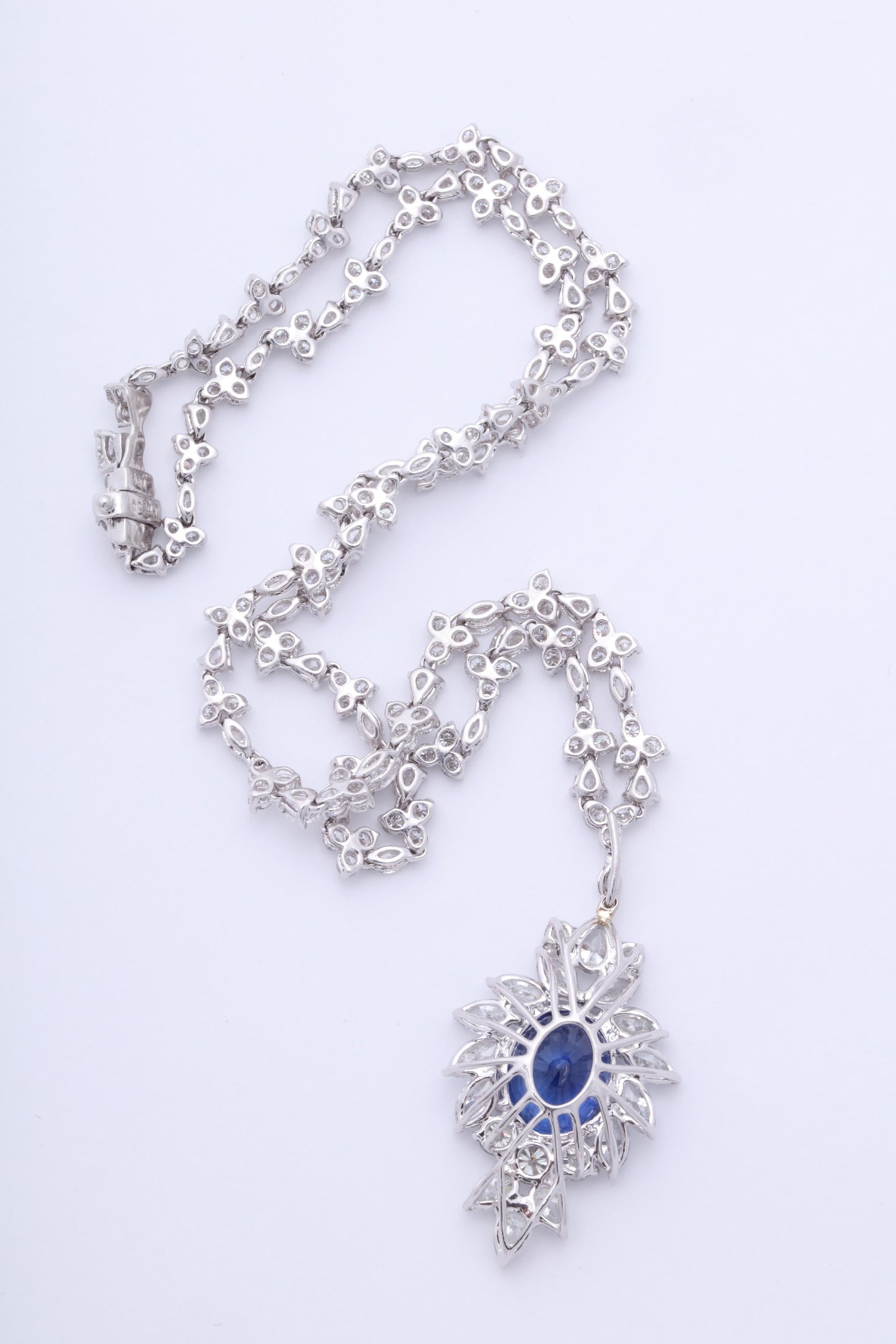 https://a.1stdibscdn.com/vivid-blue-ceylon-sapphire-and-diamond-pendant-necklace-for-sale-picture-5/0/j_56032021544653094354/6R1A3353_master.jpg