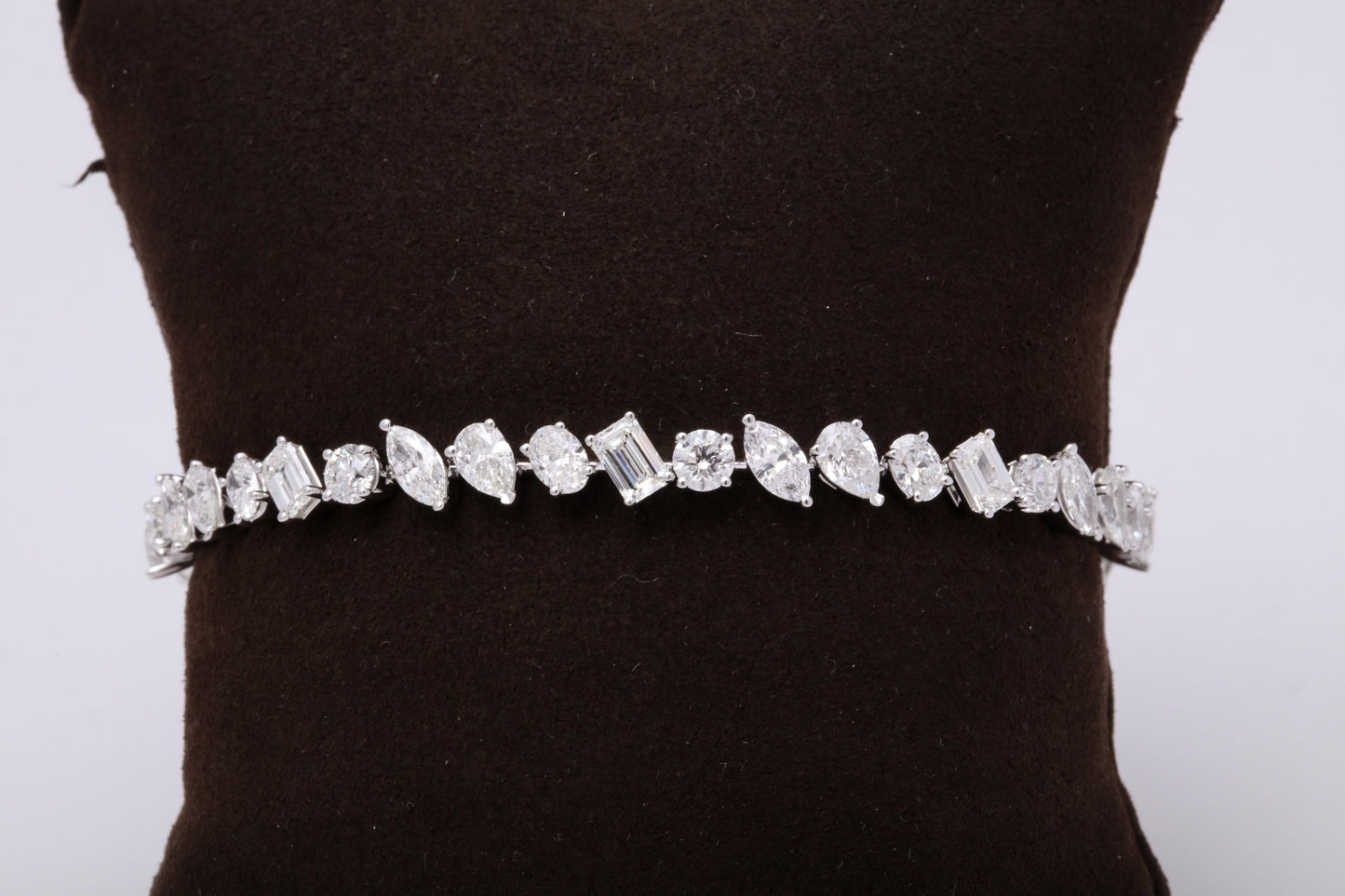 https://a.1stdibscdn.com/multi-shape-diamond-tennis-bracelet-for-sale-picture-4/0/j_57882221547578602601/6R1A3396_master.jpg