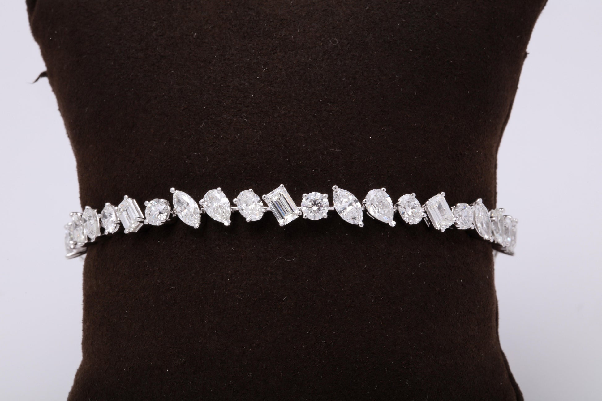 https://a.1stdibscdn.com/multi-shape-diamond-tennis-bracelet-for-sale-picture-4/0/j_57882221547578602601/6R1A3396_master.jpg