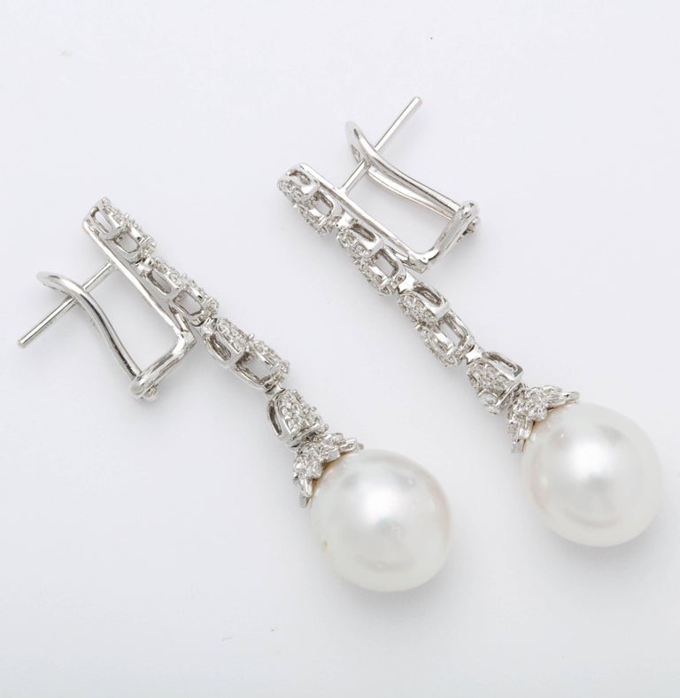 https://a.1stdibscdn.com/pearl-and-diamond-earrings-for-sale-picture-4/j_415/j_193187421684333967825/6R1A3818_master.jpg?width=768