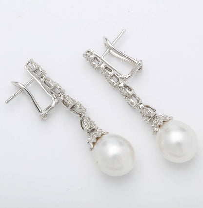 https://a.1stdibscdn.com/pearl-and-diamond-earrings-for-sale-picture-4/j_415/j_193187421684333967825/6R1A3818_master.jpg?width=768