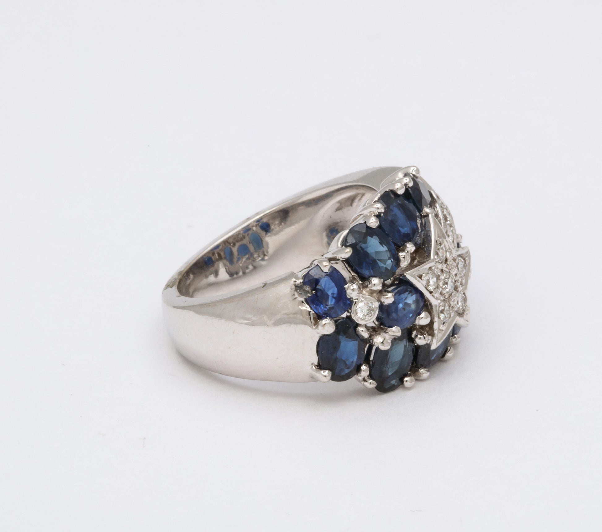 https://a.1stdibscdn.com/sapphire-and-diamond-shooting-star-cocktail-ring-for-sale-picture-3/j_415/1618934640650/6R1A4923_master.jpg