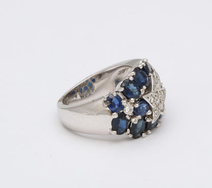 https://a.1stdibscdn.com/sapphire-and-diamond-shooting-star-cocktail-ring-for-sale-picture-3/j_415/1618934640650/6R1A4923_master.jpg