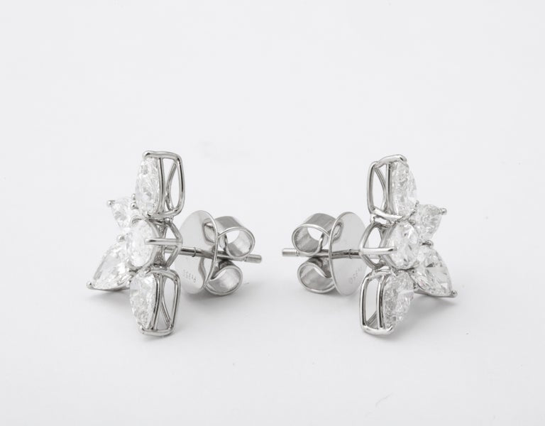 https://a.1stdibscdn.com/cluster-diamond-earrings-for-sale-picture-8/j_415/j_167933421661437842771/6R1A5084_master.jpg?width=768