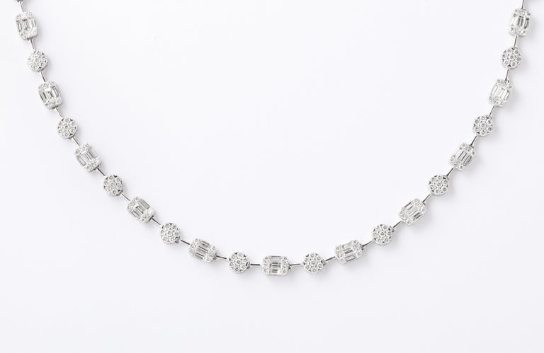 https://a.1stdibscdn.com/round-and-emerald-cut-diamond-illusion-set-necklace-for-sale-picture-5/j_415/j_164752621658414301701/6R1A5110_master.jpg?width=768