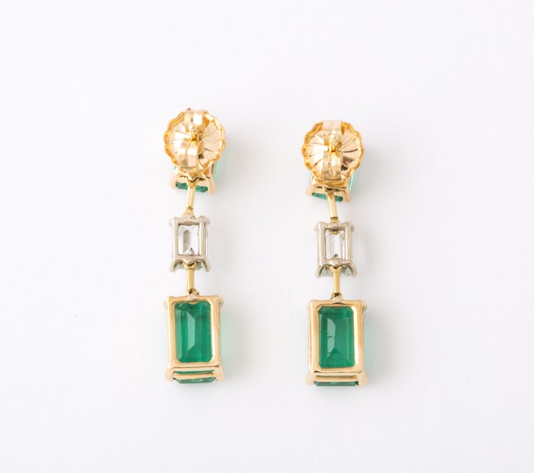 https://a.1stdibscdn.com/emerald-and-diamond-dangle-drop-earrings-for-sale-picture-7/j_415/j_180977921672758061894/6R1A5271_master.jpg?width=768