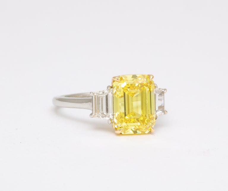https://a.1stdibscdn.com/fancy-vivid-yellow-emerald-cut-ring-for-sale-picture-4/j_415/j_174482921667400159777/6R1A5482_master.jpg?width=768