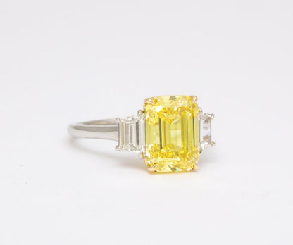 https://a.1stdibscdn.com/fancy-vivid-yellow-emerald-cut-ring-for-sale-picture-4/j_415/j_174482921667400159777/6R1A5482_master.jpg?width=768