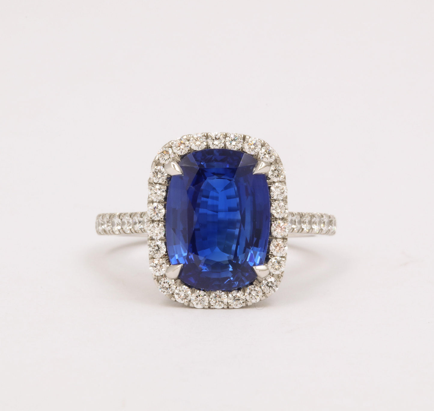 https://a.1stdibscdn.com/cushion-cut-blue-sapphire-and-diamond-halo-ring-for-sale-picture-3/j_415/j_194450021685541114217/6R1A5483_master.jpg