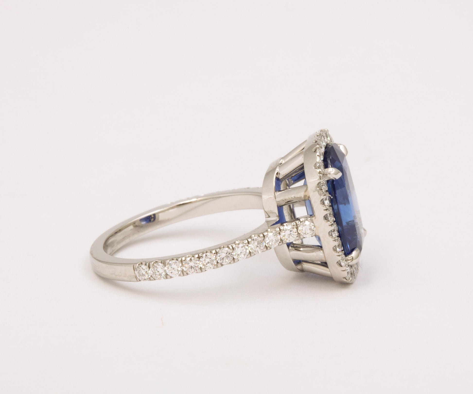 https://a.1stdibscdn.com/cushion-cut-blue-sapphire-and-diamond-halo-ring-for-sale-picture-5/j_415/j_194450021685541114504/6R1A5485_master.jpg