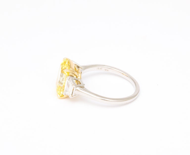 https://a.1stdibscdn.com/fancy-vivid-yellow-emerald-cut-ring-for-sale-picture-7/j_415/j_174482921667400163344/6R1A5485_master.jpg?width=768