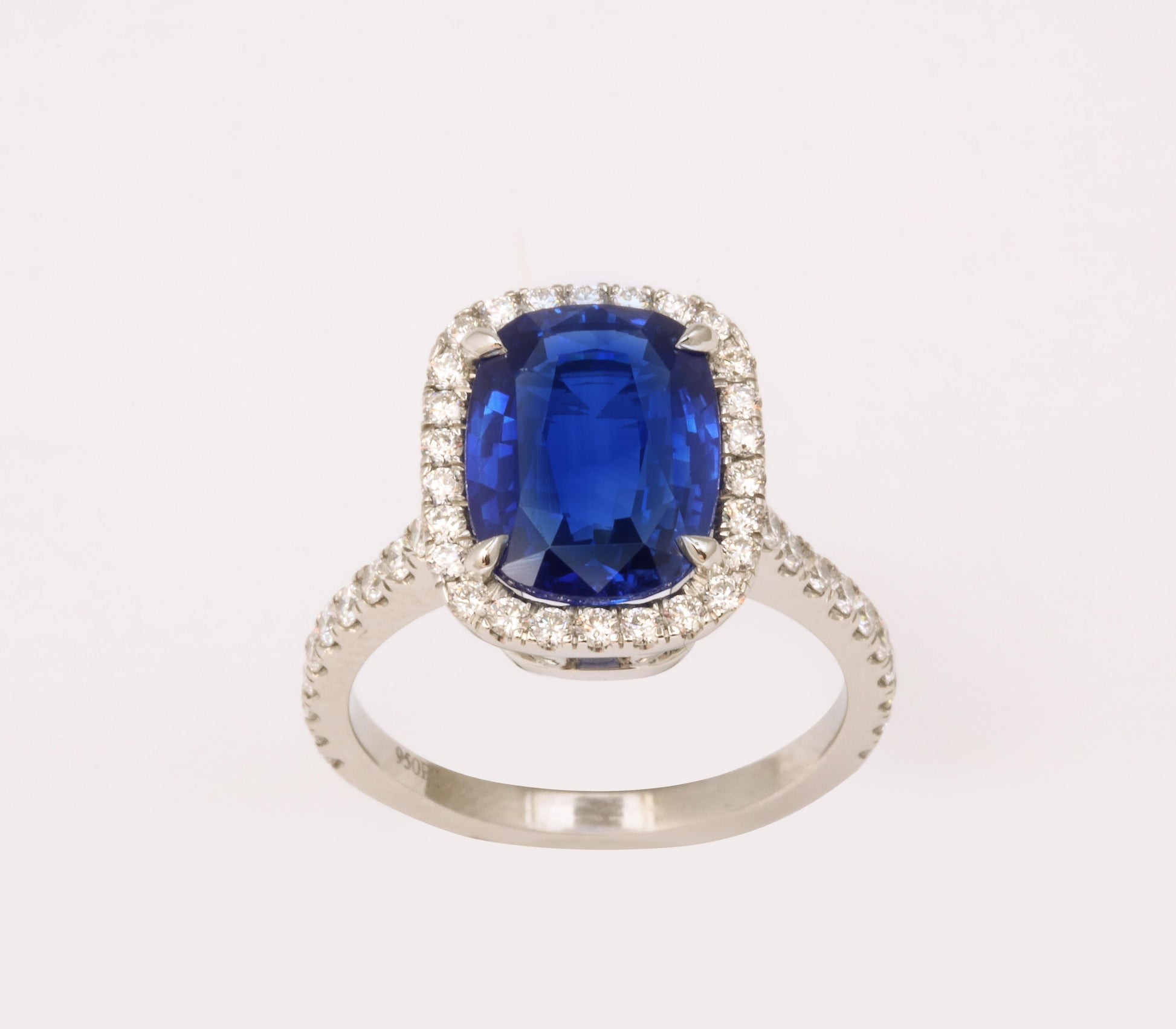 https://a.1stdibscdn.com/cushion-cut-blue-sapphire-and-diamond-halo-ring-for-sale-picture-9/j_415/j_194450021685541117216/6R1A5491_master.jpg