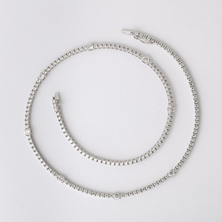 https://a.1stdibscdn.com/diamond-tennis-necklace-for-sale-picture-8/j_415/j_166501421659967984708/6R1A6030_master.jpg?width=768