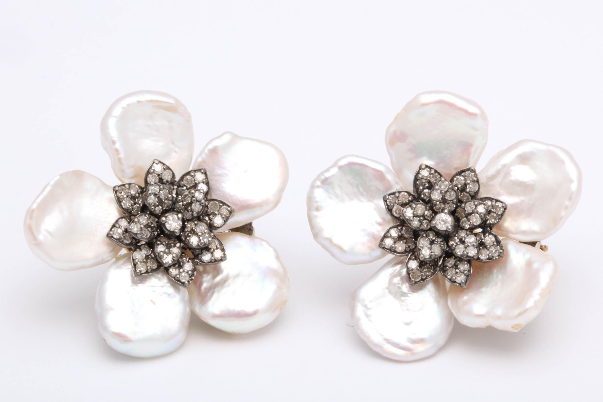 https://a.1stdibscdn.com/pearl-leaf-and-diamond-flower-earring-for-sale-picture-8/j_415/j_130060421628558034495/6R1A7171_master.jpg