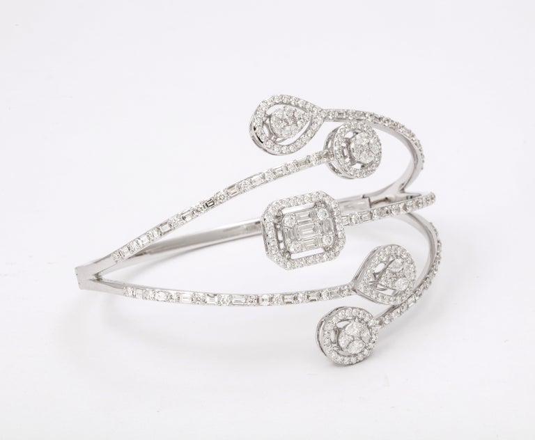 https://a.1stdibscdn.com/multi-shape-diamond-bangle-bracelet-for-sale-picture-6/j_415/j_143753121641493897550/6R1A8496_master.jpg?width=768