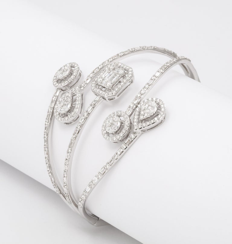 https://a.1stdibscdn.com/multi-shape-diamond-bangle-bracelet-for-sale-picture-9/j_415/j_143753121641493902179/6R1A8499_master.jpg?width=768