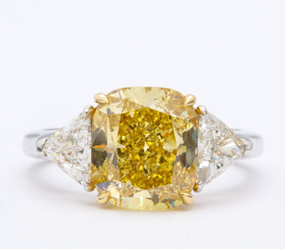 https://a.1stdibscdn.com/gia-certified-4-carat-fancy-intense-yellow-diamond-ring-for-sale-picture-2/j_415/1598973557237/6R1A9293_master.jpg