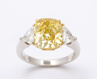 https://a.1stdibscdn.com/gia-certified-4-carat-fancy-intense-yellow-diamond-ring-for-sale-picture-5/j_415/1598973568687/6R1A9303_master.jpg