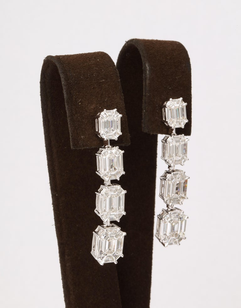 https://a.1stdibscdn.com/emerald-cut-illusion-diamond-dangle-drop-earrings-for-sale-picture-4/j_415/j_164838221658497396892/6R1A9424_master.jpg?width=768
