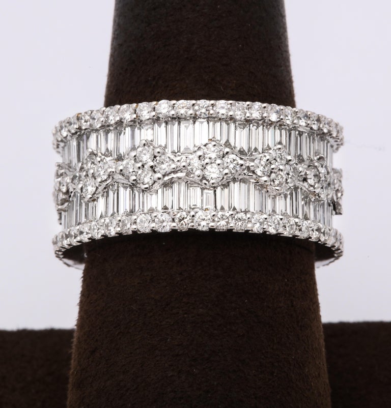 https://a.1stdibscdn.com/wide-baguette-and-round-diamond-band-for-sale/j_415/1606754930067/6R1A9887_master.jpg?width=768