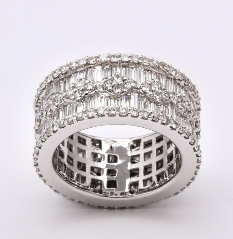 https://a.1stdibscdn.com/wide-baguette-and-round-diamond-band-for-sale-picture-4/j_415/1606754927586/6R1A9891_master.jpg?width=768