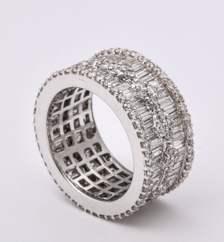https://a.1stdibscdn.com/wide-baguette-and-round-diamond-band-for-sale-picture-8/j_415/1606754944782/6R1A9895_master.jpg?width=768